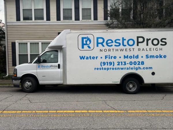 RestoPros of Raleigh's service van providing water damage restoration services